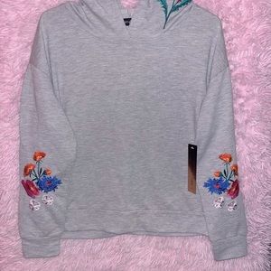 Brand new slightly cropped floral hoodie by “Almost Famous” $15!!